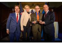 Bohdan Zachary poses with award alongside other attendees